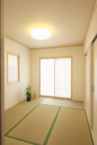 Elegant Japanese-style room with tatami mats and wooden sliding doors.